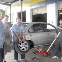 staff working on car